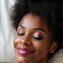 Portrait of Sarah L., a confident woman over 40, looking well-rested.